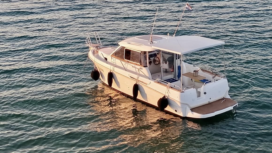 BodulaBoat motor yacht anchored in golden Adriatic light